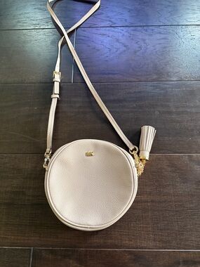 MICHAEL KORS Pebbled Round Crossbody in Light Beige with Tassel